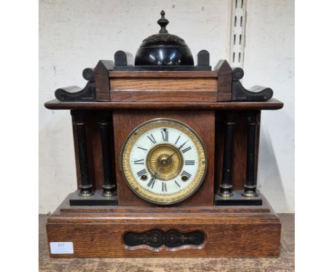 An early 20th Century French oak and ebonised architectural cased mantel clock 