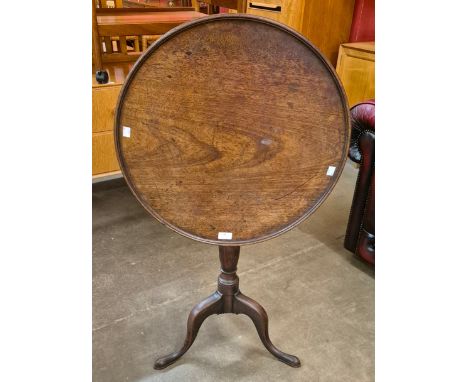A George III mahogany circular tilt top tripod tea table, Water Carter, Harrods label to underside 