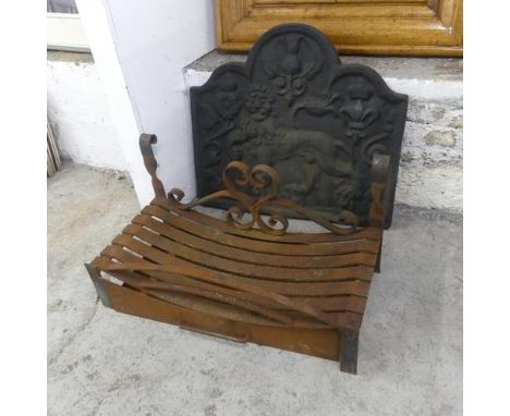 An antique cast iron fire back, width 74cm, height 67cm, and a fire grate with ember tray.