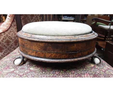 Victorian circular footstool on brass claw and ceramic ball feet, together with a mahogany wine table with circular top (2)Al