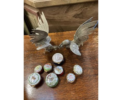 Collection of enamel boxes and pair of plated table models of fighting cocks