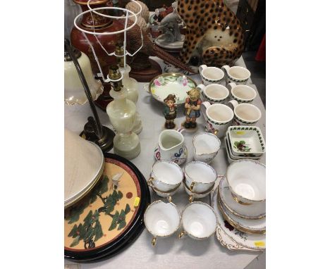 Portmeirion Pomona mugs and dishes, Poole pottery jug, two Goebel figures, other decorative ceramics and table lamps