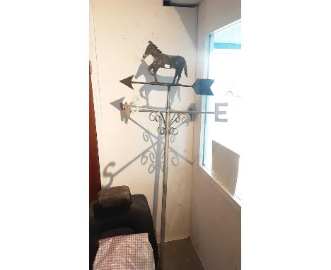 Old metal weather vane with horse surmount
