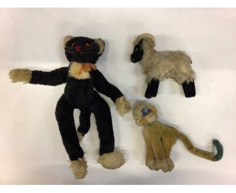 Vintage Steiff toys including fox 1542/35, Steiff black cat with orange eyes and red stitched nose, blue and yellow monkey, s