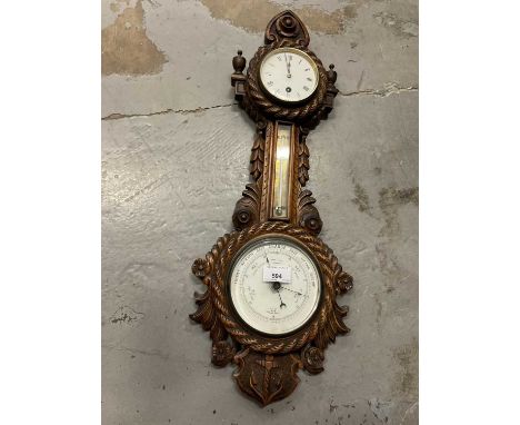 Victorian carved walnut banjo barometer signed Bothamley Boston, 63cm long