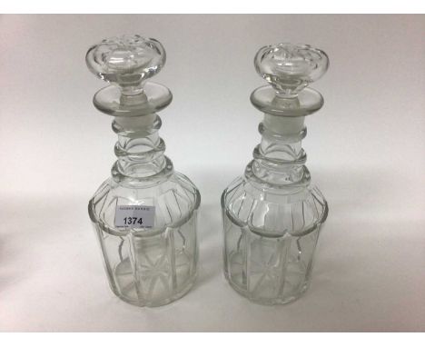 Pair of 19th century glass decanters with triple ring necks and mushroom stoppers, together with another similar (3)26.5cm hi