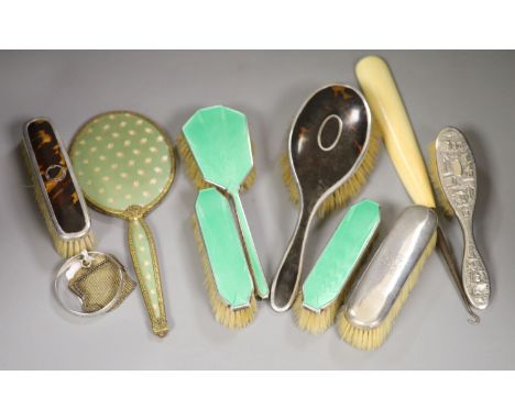 A guilloche enamel and silver-mounted three-piece brush and comb set, three other silver-mounted brushes and five other items