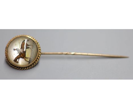 A late Victorian yellow metal and Essex crystal stick pin, decorated with horse and jockey, 7cm, gross 6.1 grams.CONDITION: T