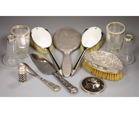 Two George IV silver mounted cut glass jars(a.f.), 10.9cm, two later silver mounted small vases, a silver mounted clothes bru