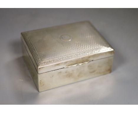 A George V engine turned rectangular cigarette box, Birmingham, 1918, 11.5cm, with engraved initials, gross 11.5oz.