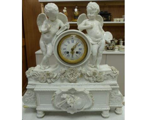 A large French porcelain white glazed 'cherub' mantel clock, height 49cm