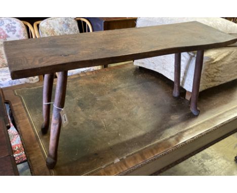 A small 19th century elm bench, on pegged legs, length 101cm, depth 30cm, height 49cm