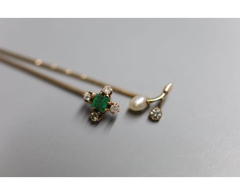 Two Edwardian yellow metal and gem set stick pins, emerald and diamond five stone, 64mm and baroque pearl and diamond, 57mm, 