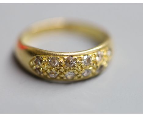 A modern 18ct gold and twelve stone diamond chip set cluster ring, size K, gross 3.7 grams.