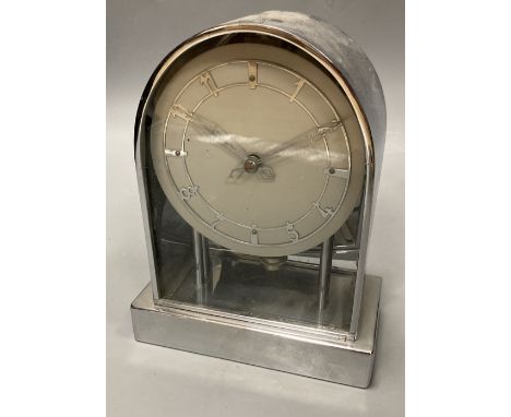 A chrome electric mantel clock with arched case, height 20cm