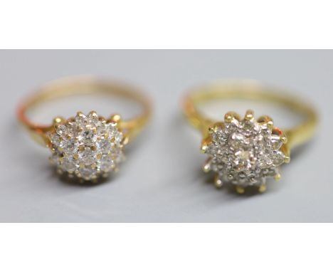 Two modern 18ct gold and diamond cluster dress rings, sizes J/K &amp; N, gross weight 7.4 grams.CONDITION: Both in generally 