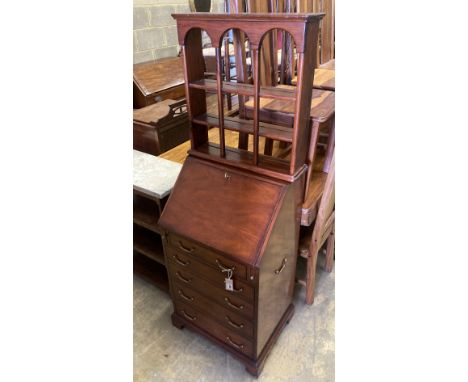 A small reproduction mahogany bureau, width 55cm, depth 43cm, height 102cm together with a three tier wall bracket