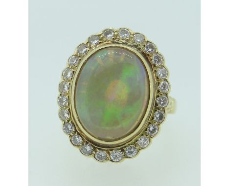 18CT YELLOW GOLD OPAL &amp; DIAMOND CLUSTER RING the opal measuring 1.1 x 1.4cms approx., 9.2grams approx. Condition Report: 