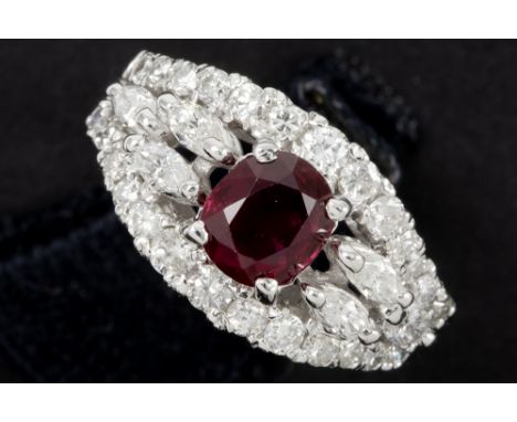 ring in white gold (18 carat) with a round cut circa 1,10 carat ruby and circa 0,90 carat of high quality brilliant and bague
