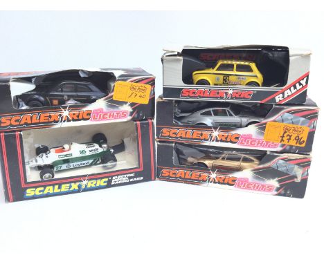 A Collection of 5 X Boxed Scalextric Cars including a Mini. 2 x Porsches. A Ford Escort and a Saudia Leyland Williams A/F. Bo