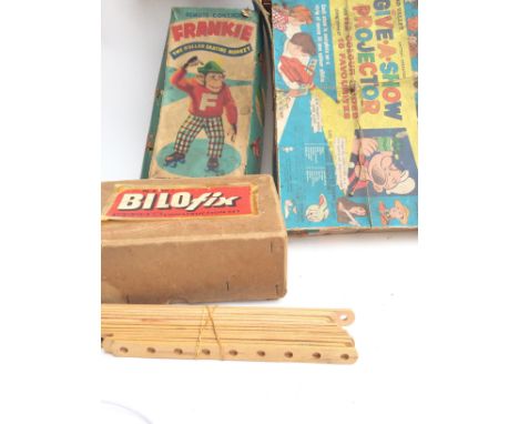 A Box Containing Vintage Toys and Puzzles including Give us A Show. Frankie the roller skating Money. Top Trumps. Etc. No Res