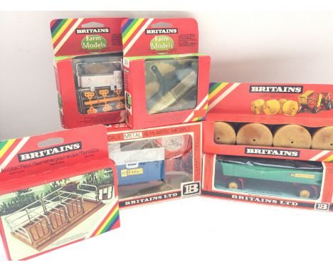 A Collection of 5 Britains Farming Implements. Animal Pens #1716. Water Trough. Heavy Roller #9549. Round Hay Bales #1743. 8-
