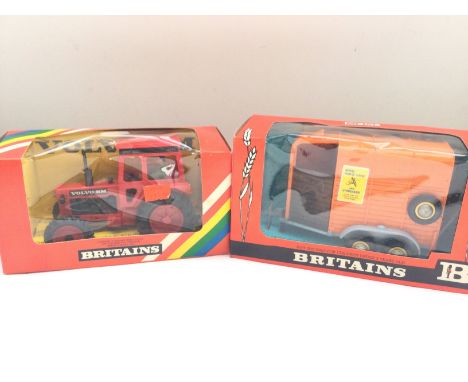 A Boxed Britains Volvo Tractor #9521 and a Double Horse Box #9562.