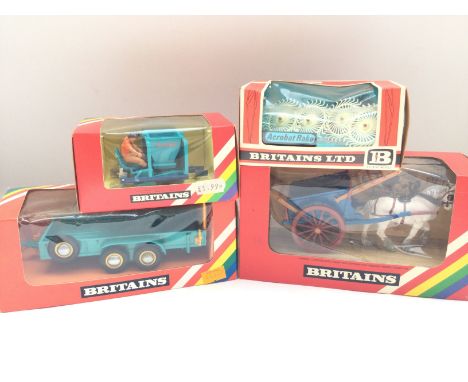 A Boxed Britains Tumbrel Cart #9499. A Acrobat Rake #9537. A Potato Planter #9541 and a Low Loader #9533.