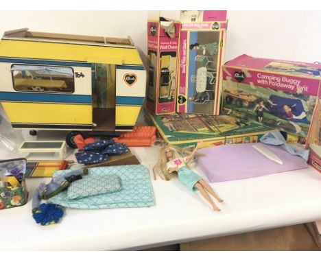 A collection of Sindy accessories including vintage incomplete wooden caravan. Includes used boxed camping buggy..hairdryer..