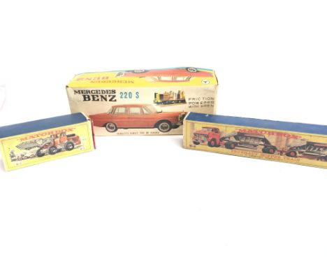 A Boxed Matchbox Hatra Tractor #K-3. A Fruehauf Hopper Train #M-4 and a Boxed Japanese Mercedes Benz 220 s.