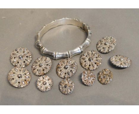 A Birmingham Silver Bangle in the style of bamboo, together with a collection of steel cut buttons 