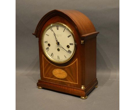 A 20th Century Bracket Clock by Comitti with shell and line inlays and three train movement with Westminster chime, 31cm tall
