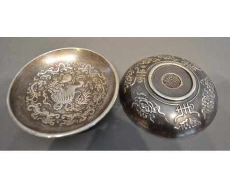 A Pair of Chinese White Metal Bowls decorated in relief with serpents amongst foliage, seal marks to base, 12cm diameter 