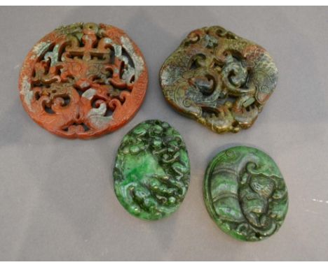 A Chinese Stone Pendant of Pierced Form, together with another similar and two similar jade pendants 