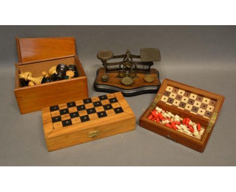 An Early 20th Century Natural and Stained Ivory Chess Set within box, together with another chess set, a pair of postal scale