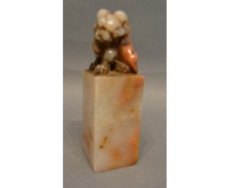 A Chinese Hard Stone Seal in the form of a Dog of Fo on a pillar, 9.5cm tall 