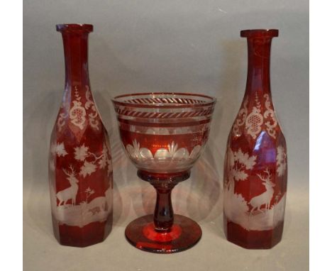 A Pair of Venetian Ruby Glass Octagonal Decanters, each etched with a stag within a landscape within a continuous band, toget