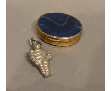 An Oval Brass Snuff Box mounted with a blue stone, together with a small model of the Michelin man 