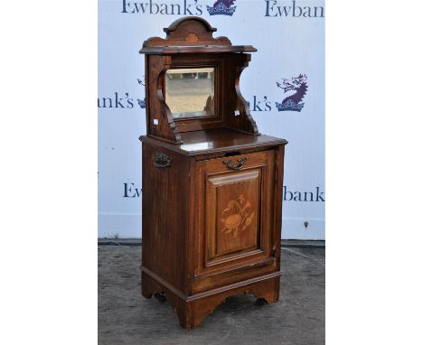 Edwardian mahogany and inlaid purdonium, upper section with mirrored alcove above panelled door, with storage within, on brac