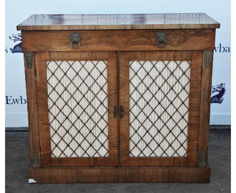 Rosewood chiffonier, 19th century, rectangular top, above frieze drawer and two doors with brass grills, with pleated cream s