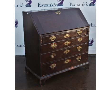 18th century oak bureau, the fall flap enclosing an arrangement of drawers and pigeonholes around a central door, above four 