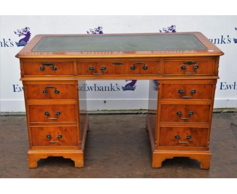 Yew wood pedestal desk, 20th Century, with green leather writing surface, above three frieze drawers, on twin pedestals with 