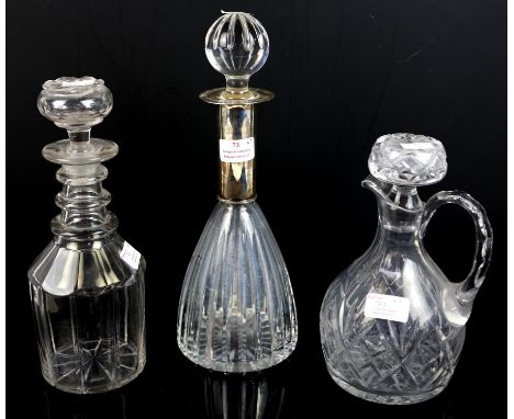 Continental silver mounted glass decanter, 35cm high, together with a 19th Century decanter and stopper, and a claret jug and