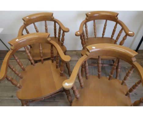 Set of four light wood Smokers Bow type armchairs on turned supports with double H shaped understretchers 