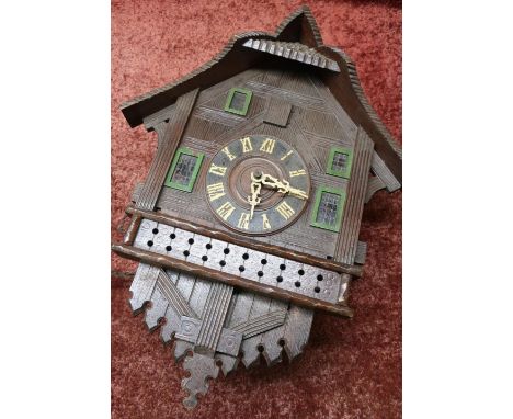 Large carved wooden cased cuckoo clock 