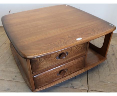 Ercol elm and beech low line coffee table with two drawers and open shelves 