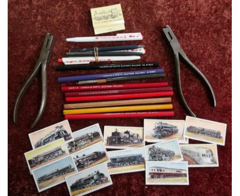 Box containing a quantity of various railway related pencils, pens, cigarette cards, ticket punches etc 