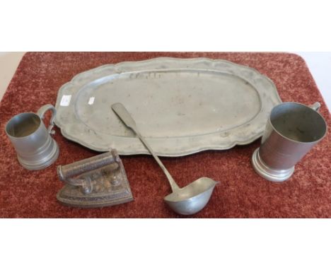 Large pewter charger, tankards, ladle and a flat iron (5) 
