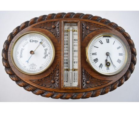 Early 20th century wall hanging barometer clock with central thermometer, bevelled glass, in carved oval oak casing, 32cm wid