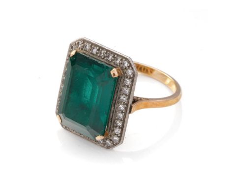 18ct gold and platinum Art Deco ring, circa 1930s, with a large central semi-precious stone (16mm x 12mm) surrounded by 32 sm